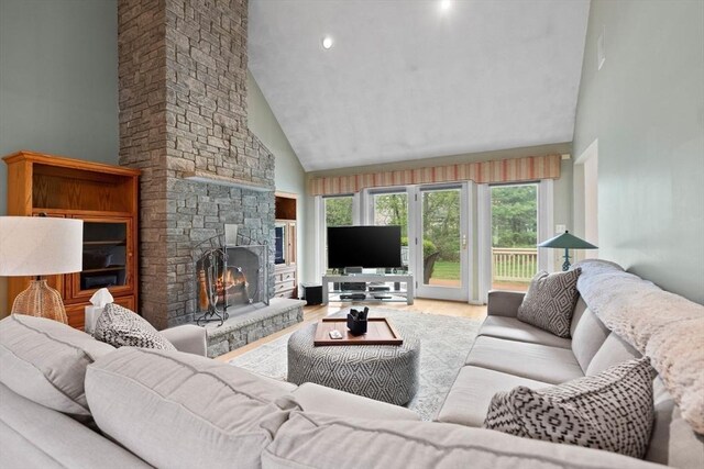 5 Campbell Rd, Middleton, MA 01949 - living room featuring high vaulted ceiling, a fireplace, and wood finished floors