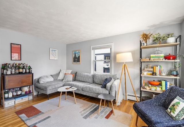 living area featuring wood finished floors and a baseboard radiator