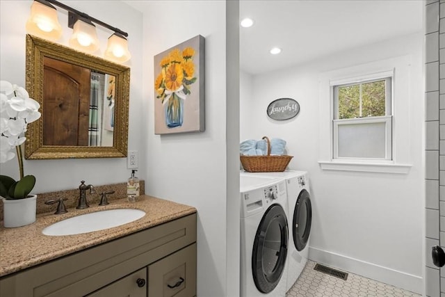 166 Klondike Rd, Dudley, MA 01571 - bathroom with washing machine and clothes dryer, vanity, baseboards, tile patterned flooring, and recessed lighting