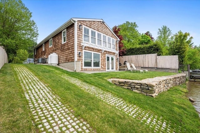 166 Klondike Rd, Dudley, MA 01571 - back of property with french doors and central air condition unit