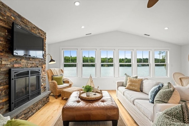 166 Klondike Rd, Dudley, MA 01571 - living area featuring lofted ceiling, a water view, wood finished floors, a fireplace, and recessed lighting