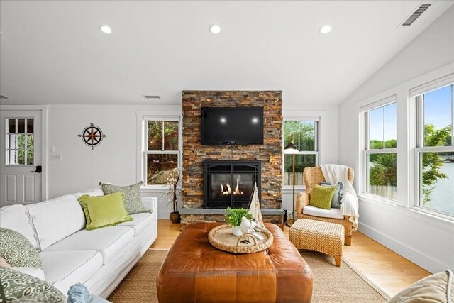 166 Klondike Rd, Dudley, MA 01571 - living area featuring vaulted ceiling, light wood finished floors, a fireplace, recessed lighting, and baseboards