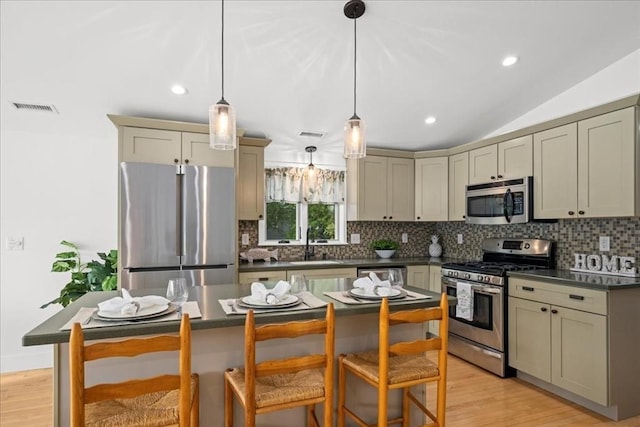 166 Klondike Rd, Dudley, MA 01571 - kitchen featuring stainless steel appliances, dark countertops, backsplash, a sink, and recessed lighting