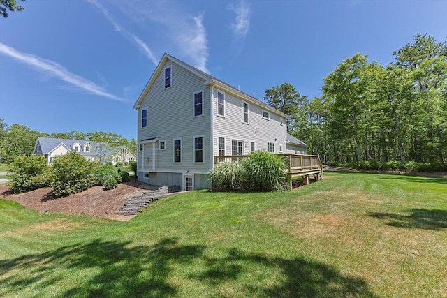 15 Littlefield Pond Rd, Harwich, MA 02645 - back of property featuring a lawn and a wooden deck