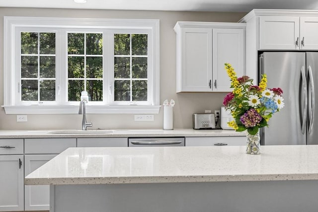 15 Littlefield Pond Rd, Harwich, MA 02645 - kitchen featuring stainless steel appliances, white cabinetry, and light stone countertops