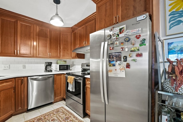 kitchen with wine cooler, hanging light fixtures, light tile patterned floors, backsplash, and appliances with stainless steel finishes