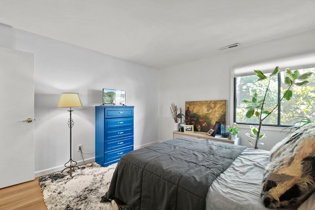 bedroom featuring light wood-type flooring