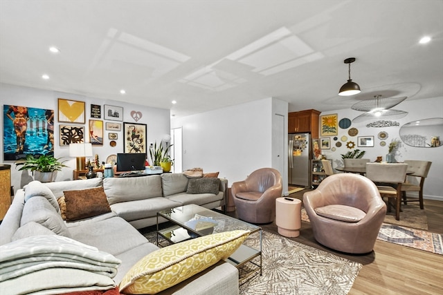 living room with light hardwood / wood-style flooring