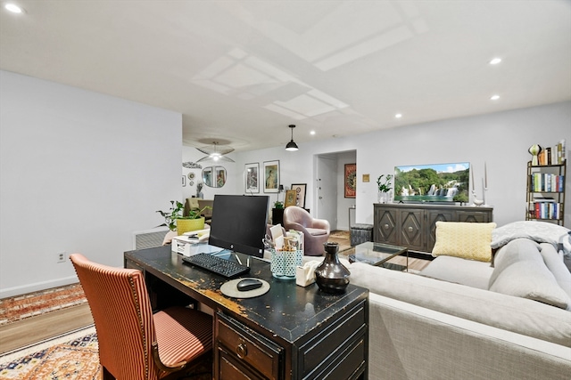 home office with wood-type flooring