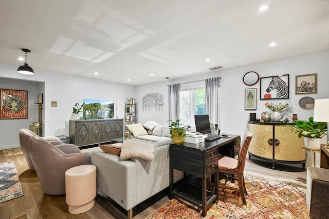 living room with light hardwood / wood-style flooring