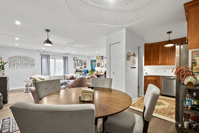 dining room featuring light wood-type flooring