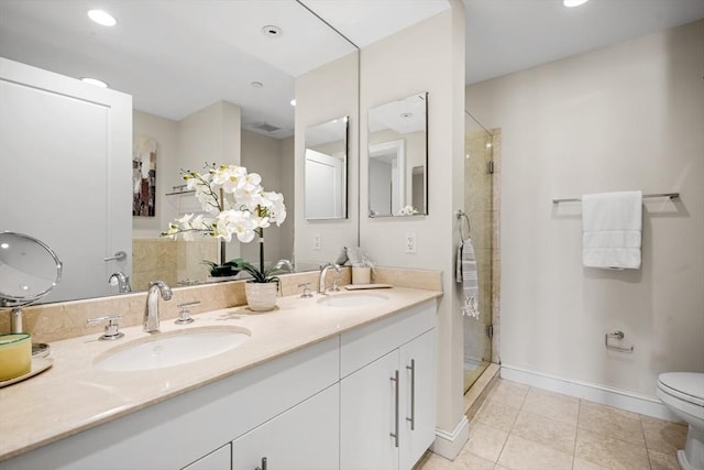 bathroom with tile patterned floors, a stall shower, double vanity, toilet, and recessed lighting