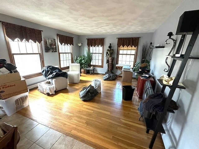 interior space featuring a textured ceiling and light hardwood / wood-style flooring