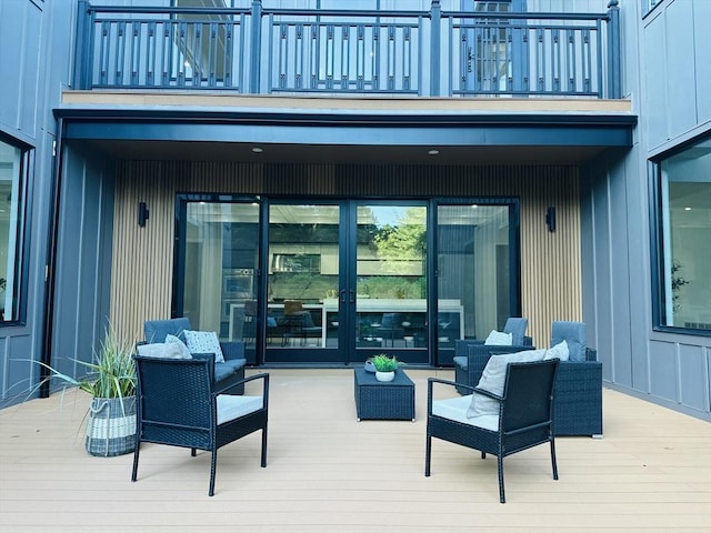 wooden terrace with an outdoor hangout area