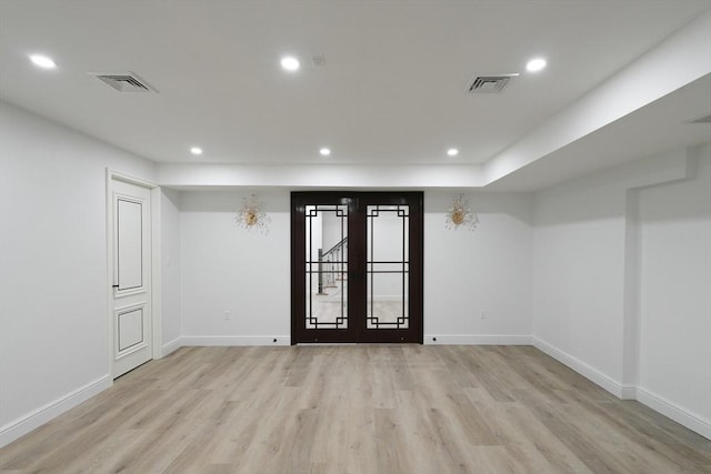 empty room with light hardwood / wood-style floors