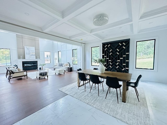 dining area with beamed ceiling and coffered ceiling