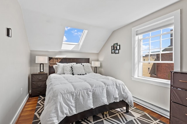 19 Wallis St Unit 4, Beverly, MA 01915 - bedroom with baseboard heating, a skylight, lofted ceiling, wood finished floors, and baseboards