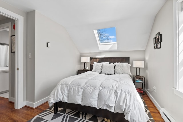 19 Wallis St Unit 4, Beverly, MA 01915 - bedroom with a baseboard heating unit, a skylight, wood finished floors, vaulted ceiling, and baseboards