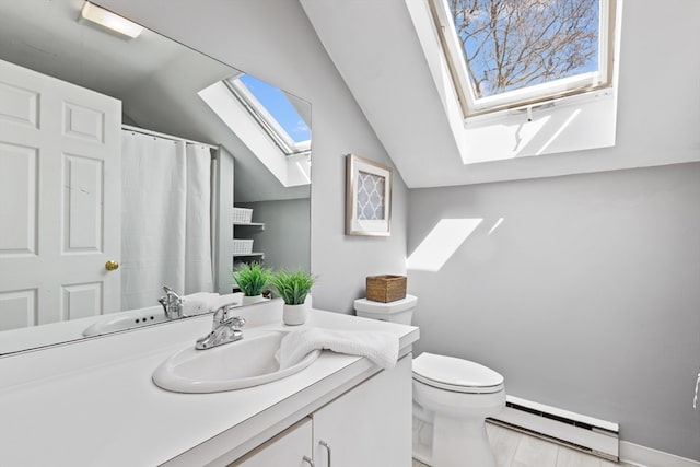 19 Wallis St Unit 4, Beverly, MA 01915 - bathroom with a baseboard radiator, a skylight, toilet, vanity, and vaulted ceiling