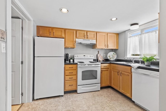 19 Wallis St Unit 4, Beverly, MA 01915 - kitchen with white appliances, under cabinet range hood, a sink, dark countertops, and recessed lighting