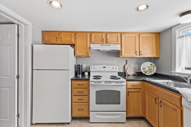 19 Wallis St Unit 4, Beverly, MA 01915 - kitchen with white appliances, under cabinet range hood, a sink, dark countertops, and recessed lighting