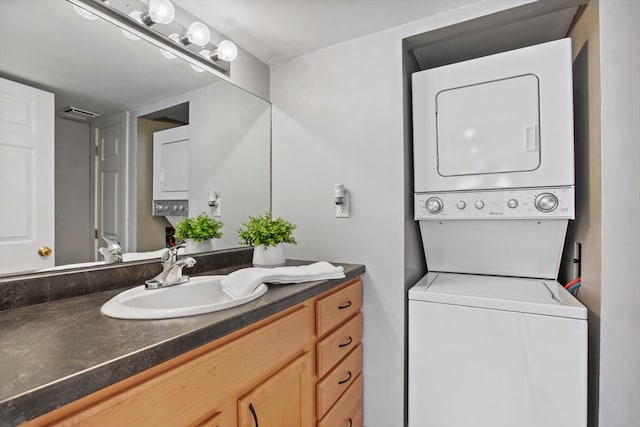 19 Wallis St Unit 4, Beverly, MA 01915 - bathroom with stacked washer and clothes dryer and vanity