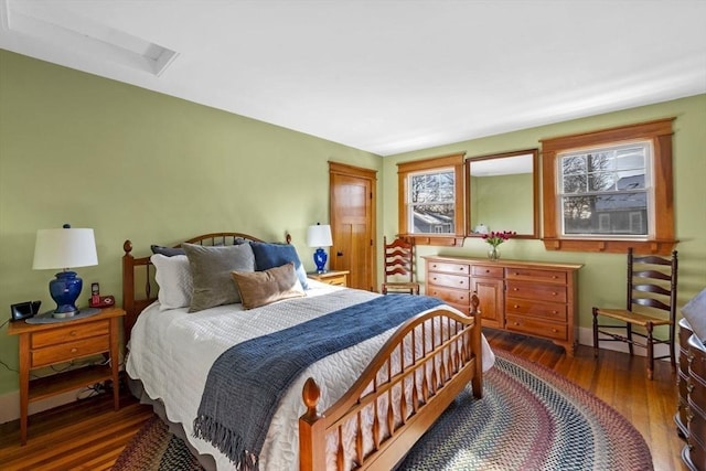 bedroom featuring dark hardwood / wood-style flooring