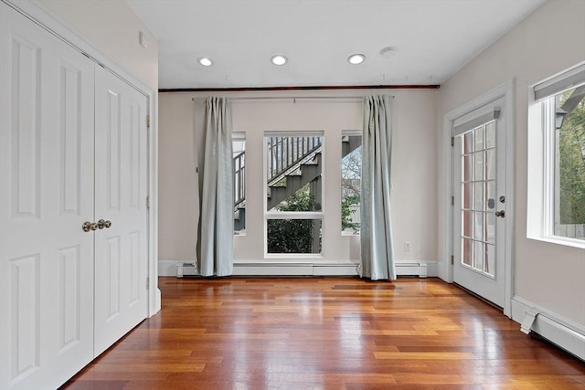 31 Millmont St Unit 1, Boston, MA 02119 - doorway to outside featuring recessed lighting, a baseboard heating unit, and wood finished floors