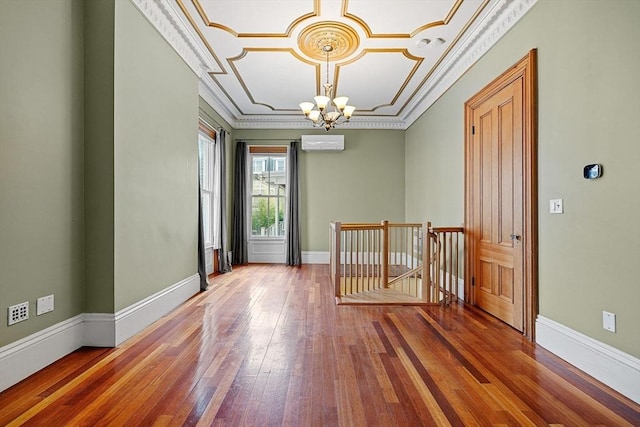 31 Millmont St Unit 1, Boston, MA 02119 - empty room with an inviting chandelier, wood-type flooring, and baseboards