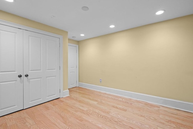 31 Millmont St Unit 1, Boston, MA 02119 - unfurnished bedroom featuring light wood-style floors, baseboards, a closet, and recessed lighting