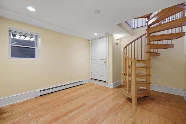31 Millmont St Unit 1, Boston, MA 02119 - below grade area with light wood finished floors, recessed lighting, baseboards, a baseboard radiator, and stairway