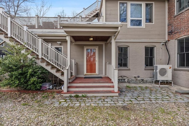 31 Millmont St Unit 1, Boston, MA 02119 - entrance to property featuring brick siding, ac unit, and a balcony