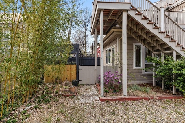 31 Millmont St Unit 1, Boston, MA 02119 - view of side of property featuring fence and stairway