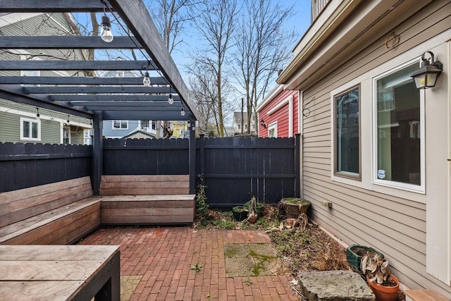 31 Millmont St Unit 1, Boston, MA 02119 - view of patio with a pergola and a fenced backyard