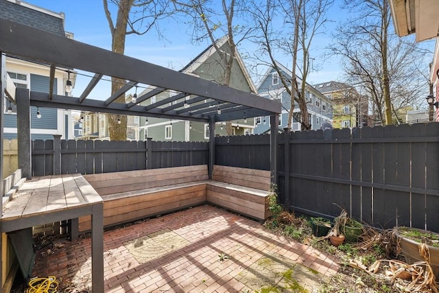 31 Millmont St Unit 1, Boston, MA 02119 - wooden deck with a fenced backyard, a patio area, and a pergola