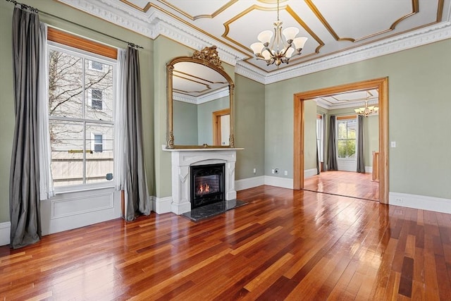 31 Millmont St Unit 1, Boston, MA 02119 - unfurnished living room with crown molding, a fireplace with flush hearth, a chandelier, and hardwood / wood-style floors