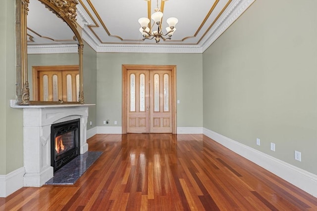 31 Millmont St Unit 1, Boston, MA 02119 - foyer with an inviting chandelier, crown molding, wood finished floors, a fireplace, and baseboards