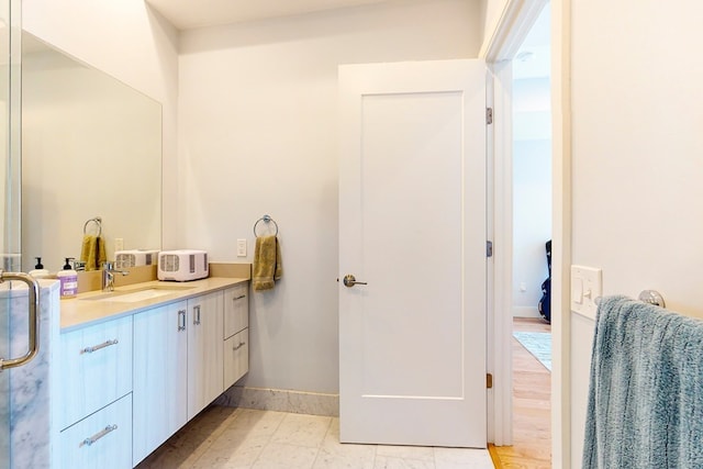 488 Dorchester Ave Unit 4H, Boston, MA 02127 - bathroom with vanity and baseboards