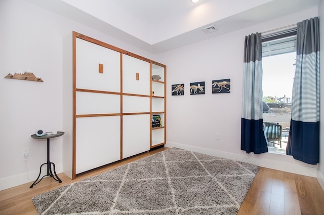 488 Dorchester Ave Unit 4H, Boston, MA 02127 - unfurnished bedroom with wood finished floors and baseboards
