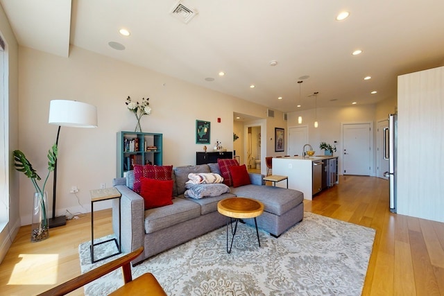 488 Dorchester Ave Unit 4H, Boston, MA 02127 - living room featuring light wood finished floors and recessed lighting