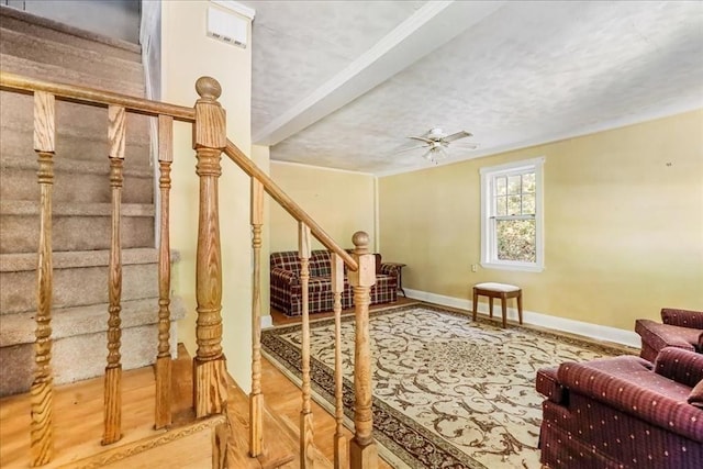 interior space with ceiling fan and a textured ceiling