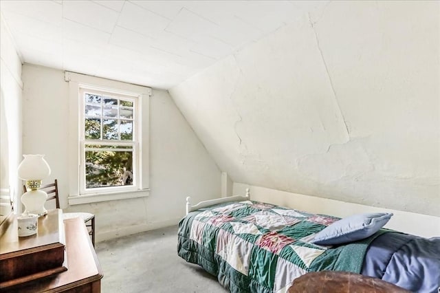 bedroom with lofted ceiling