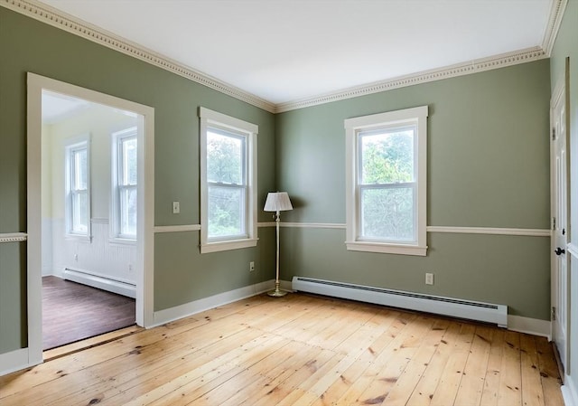 15 Reed St Unit 2, West Boylston, MA 01583 - unfurnished room with a baseboard heating unit, ornamental molding, plenty of natural light, and light wood finished floors