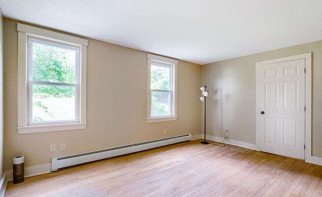 15 Reed St Unit 2, West Boylston, MA 01583 - unfurnished room featuring baseboard heating, light wood-style flooring, healthy amount of natural light, and baseboards