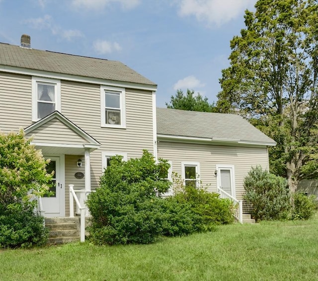 15 Reed St Unit 2, West Boylston, MA 01583 - view of front of home featuring a front lawn and a shingled roof