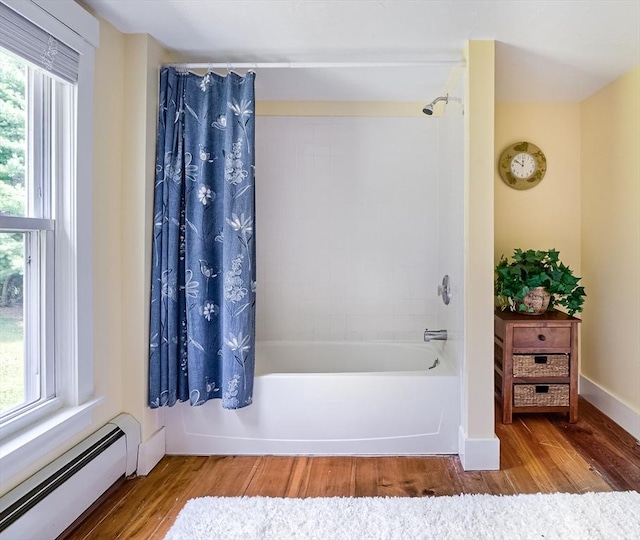 15 Reed St Unit 2, West Boylston, MA 01583 - bathroom with baseboard heating, shower / tub combo, and wood finished floors