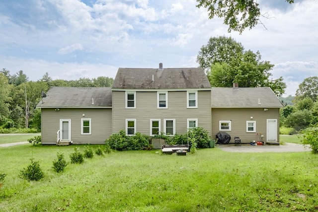 15 Reed St Unit 2, West Boylston, MA 01583 - back of property with a yard, entry steps, a chimney, and a patio area