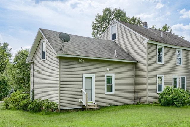 15 Reed St Unit 2, West Boylston, MA 01583 - rear view of property with entry steps, a yard, and a shingled roof