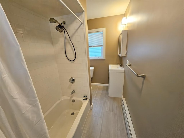 84-86R Cross St, Somerville, MA 02145 - bathroom featuring a baseboard heating unit, vanity, toilet, shower / tub combo with curtain, and baseboards