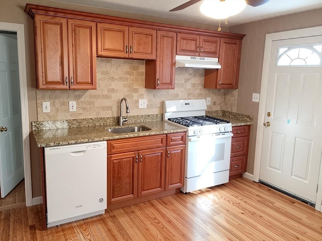 84-86R Cross St, Somerville, MA 02145 - kitchen with white appliances, under cabinet range hood, a sink, brown cabinets, and light wood-type flooring